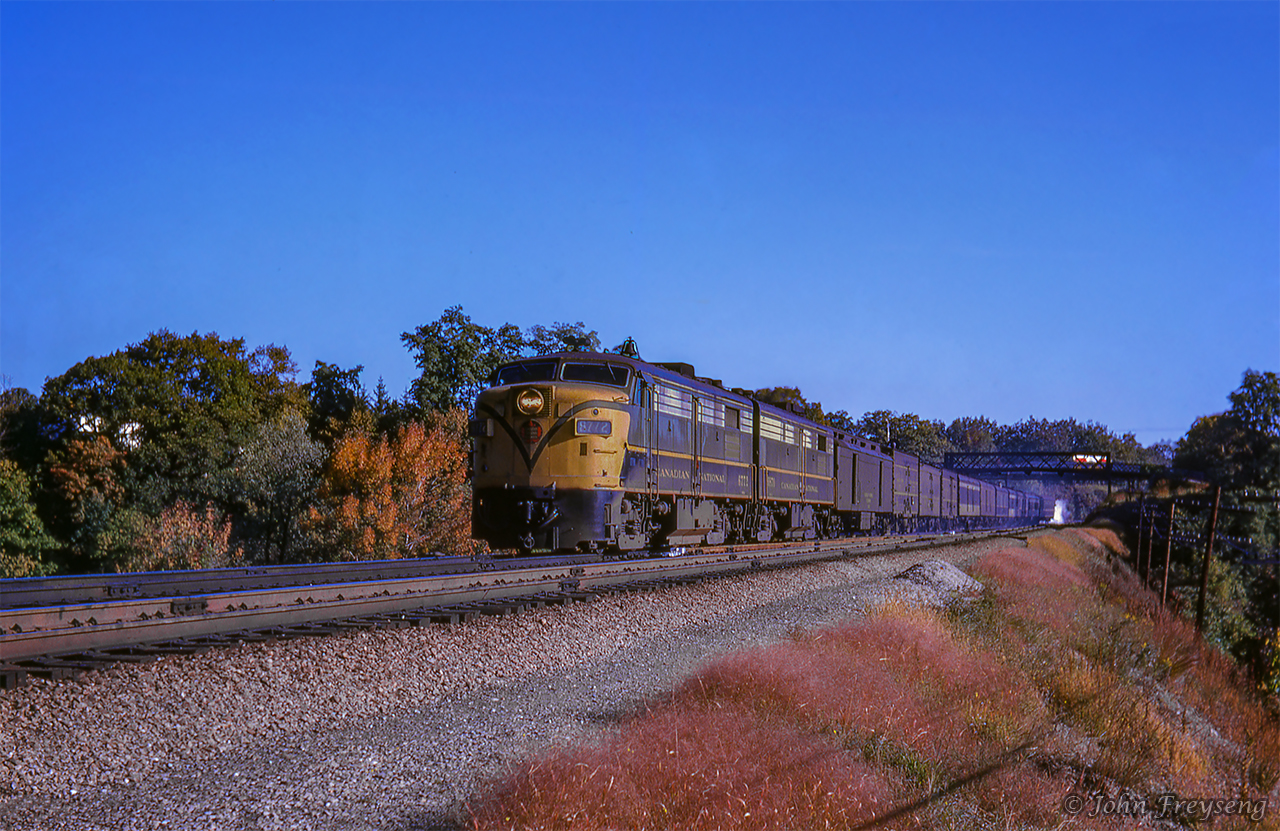 Toronto - London train 77 heads west through Bayview Junction towards its stop at Hamilton's James Street station, where the three head end express boxcars will be setout.  Shortly, it will reverse back out to Bayview, and continue its journey west.Scan and editing by Jacob Patterson.