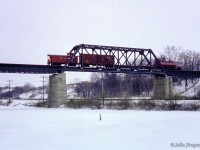 Canadian Pacific's Simcoe wayfreight rolls southbound along the former Lake Erie & Northern Railway, crossing the bridge over New York Central's CASO mainline.  The GMD SW8 was sold to <a href=http://www.rrpicturearchives.net/showPicture.aspx?id=1767352>Ogeechee Railroad of Georgia</a> in 1989 as their 101, and is still operating today, once again <a href=https://www.railpictures.net/photo/684312/>wearing it's original number.</a><br><br><i>Scan and editing by Jacob Patterson.</i>