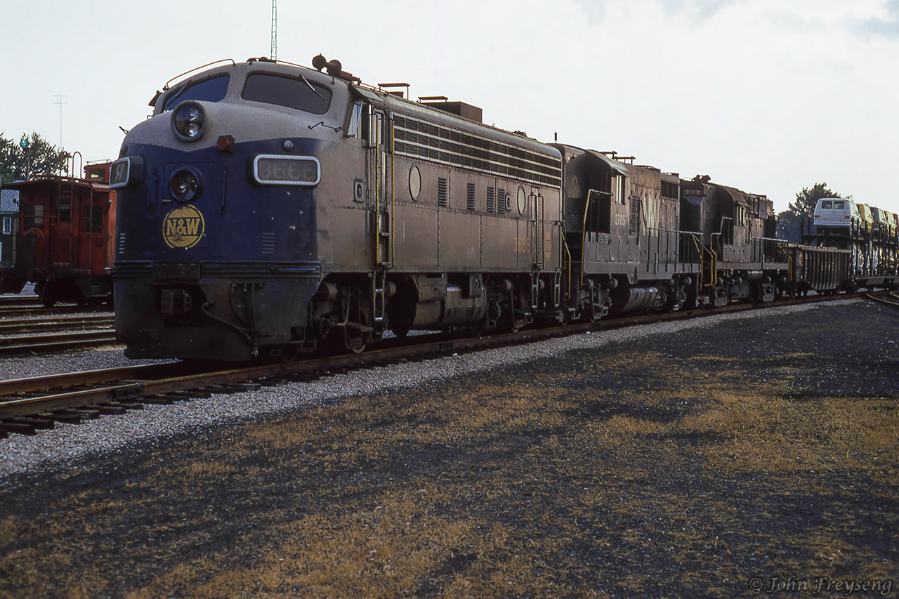 An eastbound Norfolk & Western freight, led by an ex Wabash FP7, a GP18, and an RS11, is seen parked at St. Thomas.Scan and editing by Jacob Patterson.