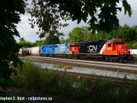 Interesting power moves on CN as they've purchased 7 former UP GP38-N's (GP38-2's on CN) from Metro East Industries of East St. Louis, IL. These 7 came over the summer, and is seen here put together with a GTW and CN's 2020's acquisition from the GMTX Series. This piecemeal acquisition 'spree' along with the BNSF's have turned some heads as CN has not done this in quite some time for four axle units, if at all. This series, numbered right after GTW 4934 but as CN may continue to grow - who knows how many they will get? Note these were painted by MEI.<br><br>
This unit was replaced with BNSF 2090 today in Kitchener.