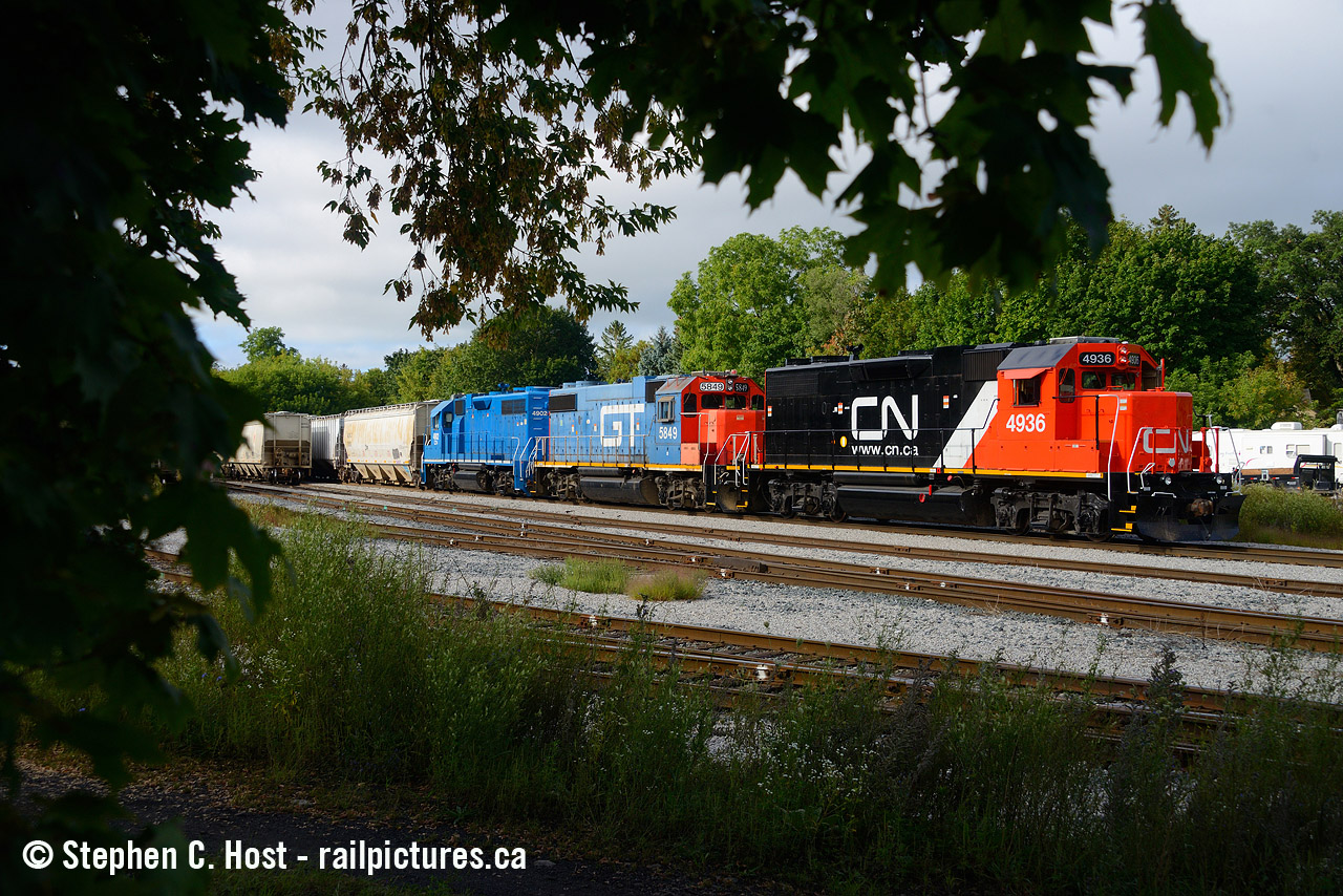 Interesting power moves on CN as they've purchased 7 former UP GP38-N's (GP38-2's on CN) from Metro East Industries of East St. Louis, IL. These 7 came over the summer, and is seen here put together with a GTW and CN's 2020's acquisition from the GMTX Series. This piecemeal acquisition 'spree' along with the BNSF's have turned some heads as CN has not done this in quite some time for four axle units, if at all. This series, numbered right after GTW 4934 but as CN may continue to grow - who knows how many they will get? Note these were painted by MEI.
This unit was replaced with BNSF 2090 today in Kitchener.