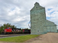 CN 5276 and CN 5350 heading south past the Viterra (formerly Alberta Wheat Pool) elevator in Camrose, Alberta.