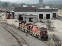 This pair of locomotives east of Port Coquitlam diesel shop match the new four-letter railway company id.<br>
CP 8763 is a GE ES44AC, while KCSM 4092 is an SD70ACe assembled at Bombardier-Concarril in Sahagun Mexico.  
Seems like all KCS units I saw here on my 2 visits, 2 weeks apart, were KCS de Mexico. <br><br>
The sidewalk on the west side of the Coast Meridian overpass provides this safe public viewpoint. <br>
Drawback is the bridge's full-height end-to-end horizontal/vertical rigid steel mesh - the just-under 2 inch square holes are too small for many camera lenses, especially when angling downward, left or right.