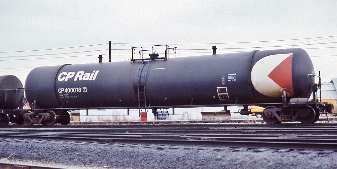 Three piece petroleum tanker, built  Sept 1975: CP Rail 400018


 Company use only ?


  At CP Rail Agincourt, January 27, 1980 Kodachrome by S.Danko