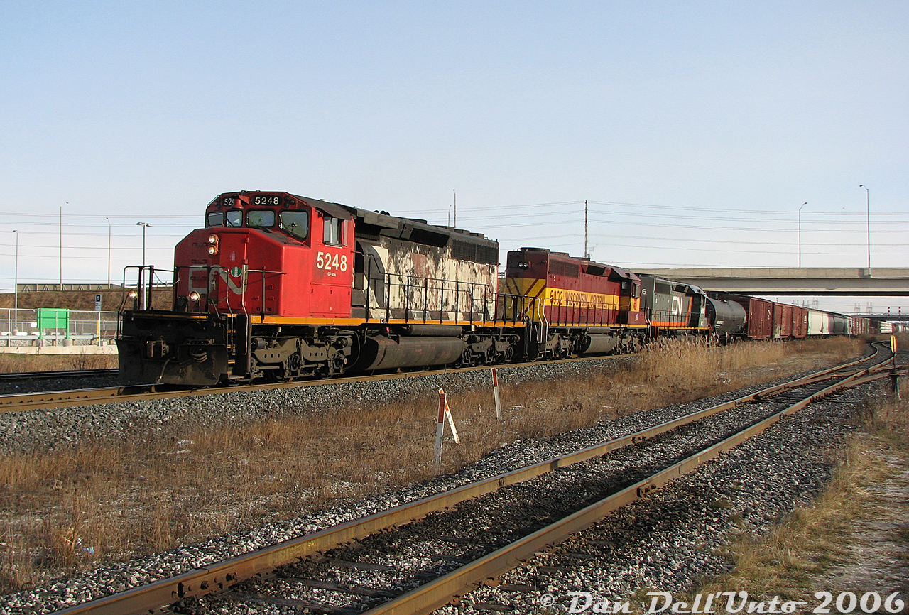 A lashup like this today would quickly bring many trackside, but in 2006 these slipped through all the time as a regular occurrence. An unknown mid-morning CN 300-series westbound rolls through Bramalea GO Station with three SD40's in charge: CN SD40-2W 5248, Wisconsin Central SD40-2 6002 (ex-Algoma Central), and WC (ex-GCFX) SD40-3 6916. Not bad for a catch while waiting for the next GO train to Toronto. All three are off the roster today, victims of CN's late 2000's SD40 purge.