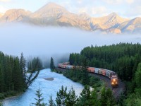 Snaking along the banks of the Bow river, this eastbound potash train rolls eastward through Morant's Curve with CP 8754 on point. 