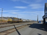 <b> Trains and grains. </b> <br>
CN 2788 ES44AC with a yard long string of grain hoppers sits idle in front of the Kamloops North VIA Rail station at Kamloops, BC on a very pleasant October 26, 2023 morning.