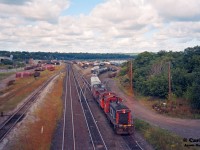 In a scene that has since dramatically changed, consecutive numbered CN SW1200RS units 1360 and 1359 go about their morning duties, switching Hamilton's Stuart Street Yard.