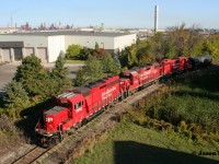 During an early fall morning CP TH41 with 2205, 3113 and 3033 is viewed with one tanker after departing possibly Parkland in Hamilton, Ontario’s rich industrial core. 