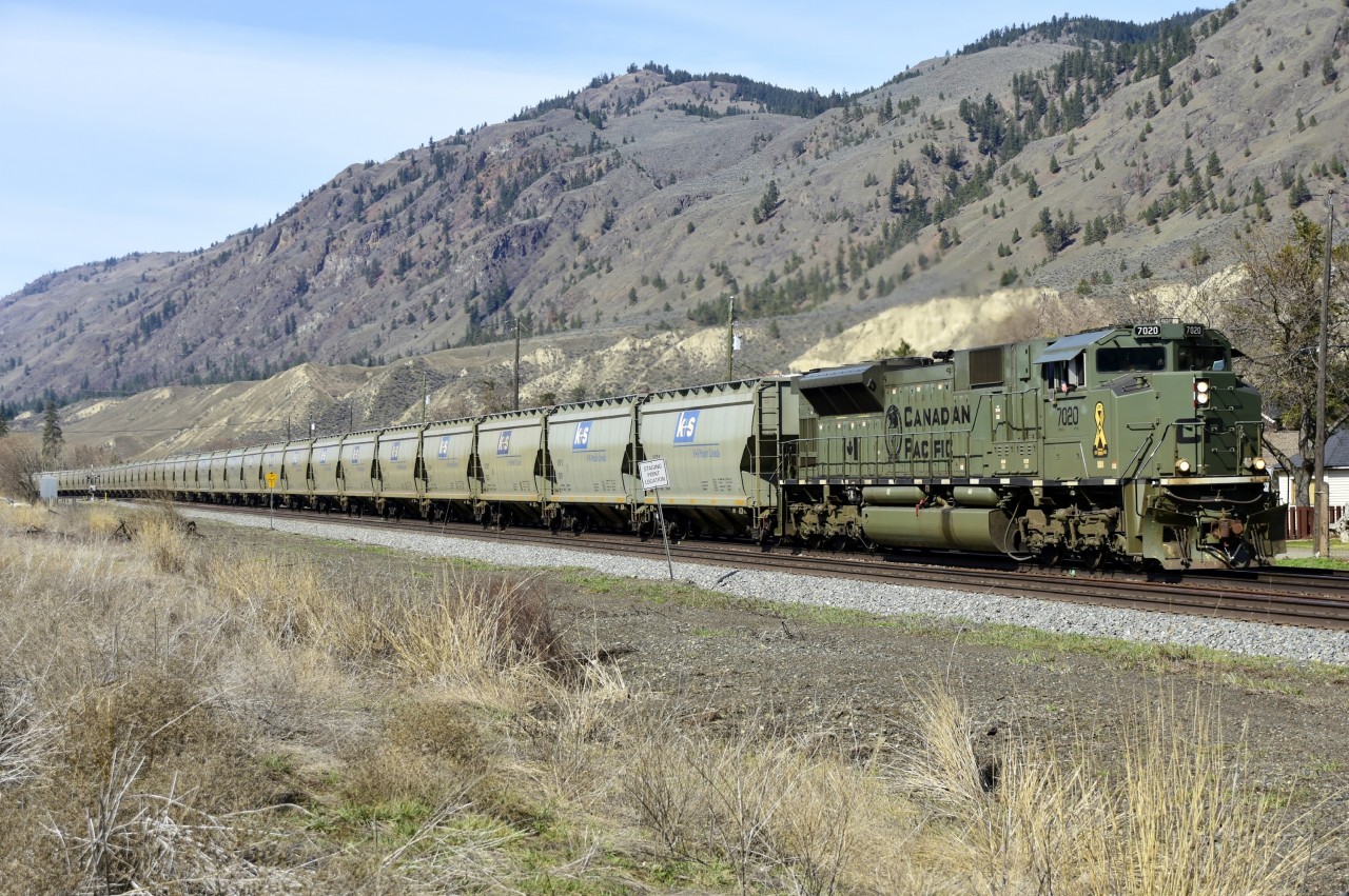 An eastbound empty potash is seen rolling through Monte Creek behind "NATO" unit CP 7020. The company K+S does a remarkable job of keeping their cars graffiti free!