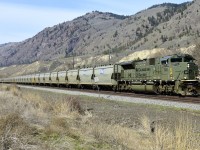 An eastbound empty potash is seen rolling through Monte Creek behind "NATO" unit CP 7020. The company K+S does a remarkable job of keeping their cars graffiti free!