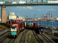 POM 1001 is about to shove cars in the Port of Montreal as an end of train device gets added to stacks at left.