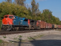 CN 435 charges upgrade through Copetown at track speed behind CN 8952, the GTW heritage unit.