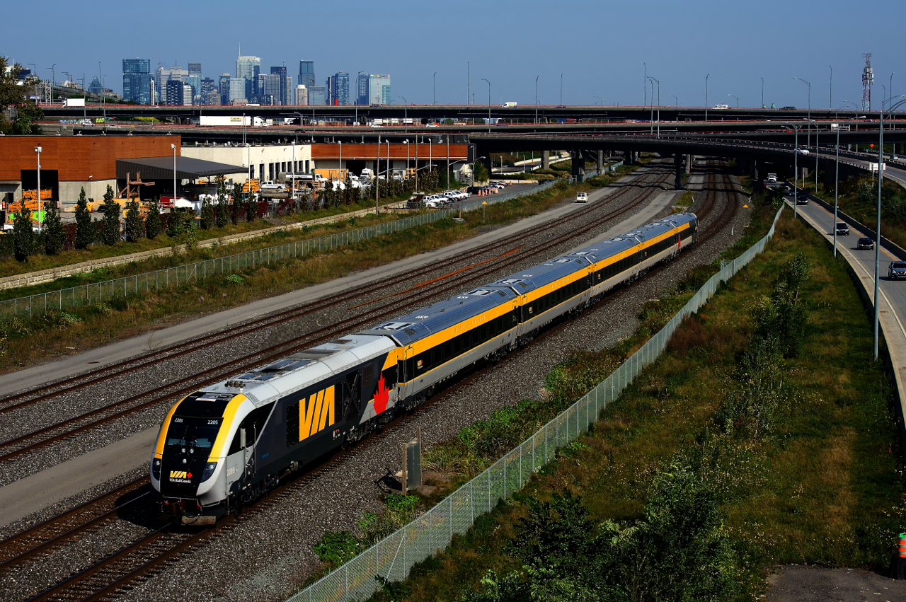 One of VIA Rail's more recently delivered Siemens trainset is on VIA 35 as it passes the skyline of downtown Montreal.