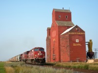 Having originated at the mine just south of Guernsey SK, CPKC train 601's journey to the west coast has only just begun. The southbound potash loads are seen passing the former Pool elevator at Duval on the Lanigan Subdivision. 