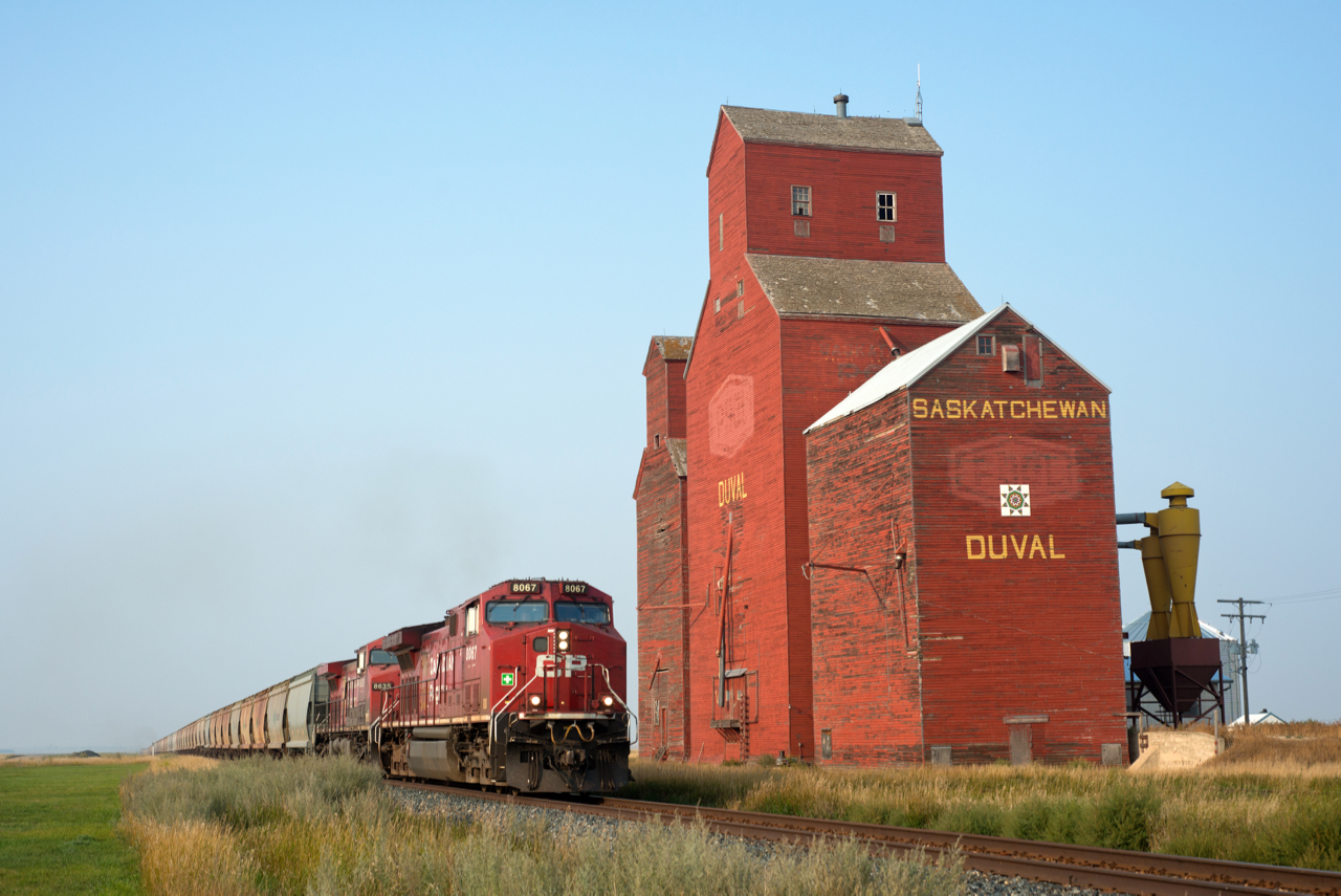 Having originated at the mine just south of Guernsey SK, CPKC train 601's journey to the west coast has only just begun. The southbound potash loads are seen passing the former Pool elevator at Duval on the Lanigan Subdivision.