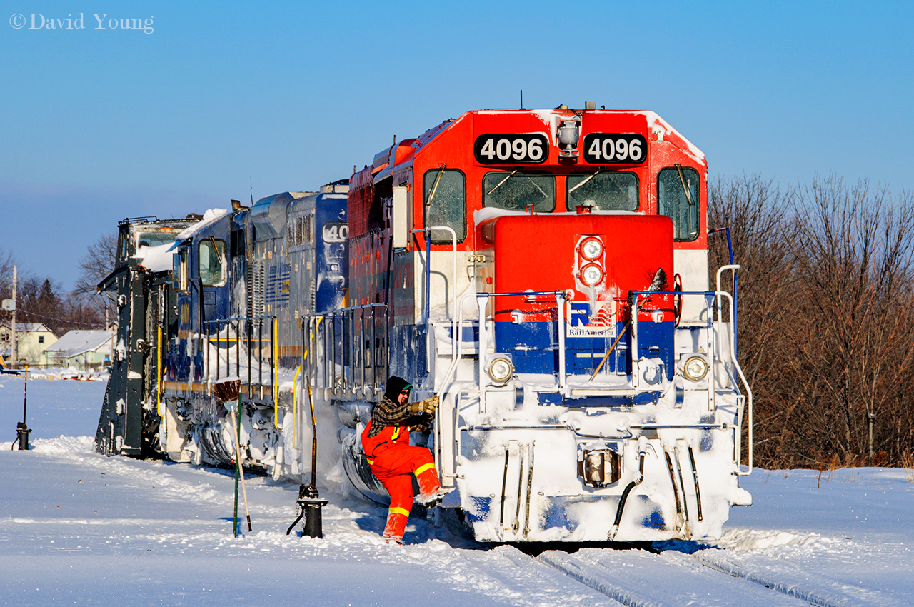 Having completed their early morning run up the Goderich, Conductor Snook entrains RLK 4096 as the plow movement continues its forward progressing towards the west end of the yard. Sooner than anticipated, regularly scheduled freight GEXR 581 will arrive at Goderich with its usual string of empties for the salt mine. RLK 4096 would be left switched off this plow extra and onto 581 to lift while the plow extra would return eastward with just  RLK 4001 to Stratford.