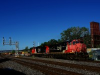 After dropping off most of its train at Taschereau Yard, CN 100 is heading to the Port of Montreal with only 23 platforms. Power is a pair of Dash9s built a decade apart; Dash9-44CWL CN 2515 and Dash9-44CW CN 2205.