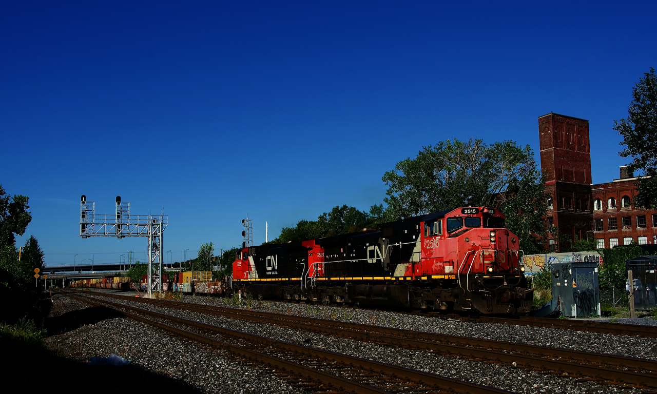 After dropping off most of its train at Taschereau Yard, CN 100 is heading to the Port of Montreal with only 23 platforms. Power is a pair of Dash9s built a decade apart; Dash9-44CWL CN 2515 and Dash9-44CW CN 2205.