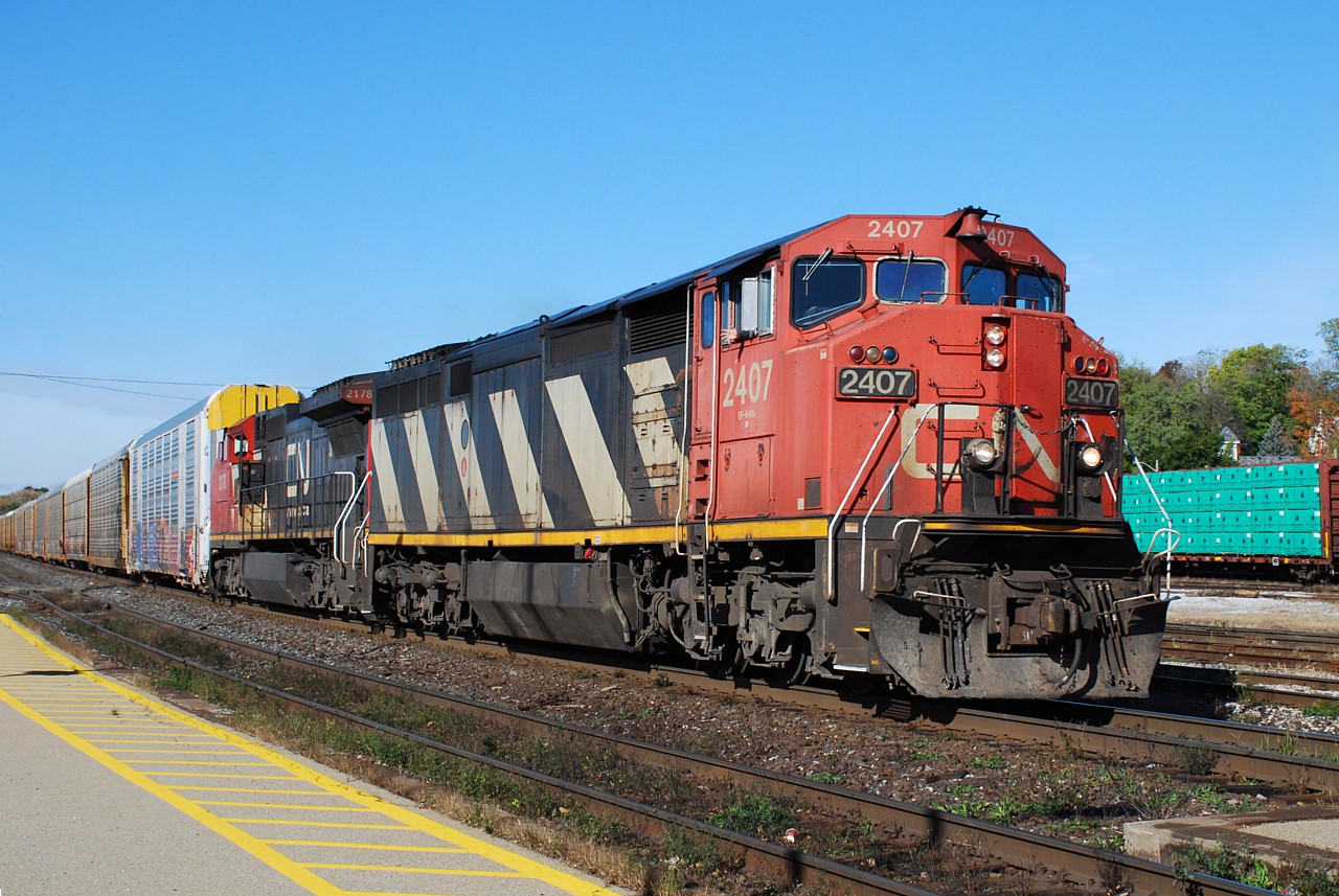 It's interesting, looking back through older photos, how quickly some can become nostalgic. This photo was taken in 2018, while wasting another lunch hour away at the station. An eastbound came into the viewfinder with two C-40-8 variants leading on a beautiful Fall day.  Fast-forward to 2023, you'd be lucky to see a C40-8.