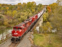 CPKC 135 with a pair of CP SD70ACU's, 7000 and 7003 heads south over the Thames River as it passes Coakley Siding in the town of Woodstock, Ontario.  I wasn't sure how long this train would take to work Wolverton, but thankfully it wasn't too long.  I heard him coming over the scanner and booked it towards the Vansittart Avenue bridge.  I am glad that I made it for this one - a pair of red ACU's complimenting the fall colors - with intact code lines, searchlights, and a bridge?  How could you go wrong?

October 15, 2023.