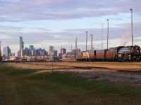 The Empress shoves into the South Edmonton Yard, with Edmonton's Skyline providing a beautiful backdrop as the sun sets on Alberta's Capital City.  The rails end about a mile north of here, by the old CPR South Edmonton Station, which has since been turned into a restaurant.  Known as Strathcona, its a bustling part of the city - however on the railroad side of things, the South Edmonton Yard only sees sporadic service from a local freight and much of the yard has been turned into a Lumber Transload facility.; CPKC's freight trains branch off just south of here towards Lambton Park and Clover Bar Yards.  

While South Edmonton is a shadow of its former self, it is not hard to imagine a CPR Passenger train blasting out of the South Edmonton Station, with the skyline in the background as they head south to Calgary.  