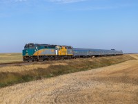 The Canadian operating 5 hours late, blasts through through Keppel, Saskatchewan with twenty coaches.