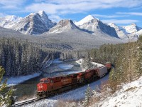 Although the sun is shining, it is a brisk -21 degrees at Morant's Curve as CPKC 200 rolls downhill towards Calgary.