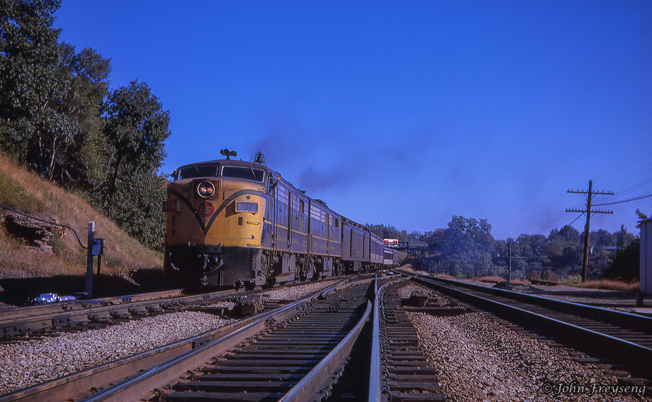 Toronto - London train 77 is seen crossing over from the south track of the Oakville Sub, taking the switch onto the north track of the Dundas at Bayview Junction.  77 has just backed out to Bayview after stopping at Hamilton's James Street station, where the three head end express boxcars seen earlier as it passed by were setoff.Scan and editing by Jacob Patterson.