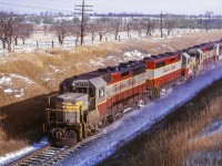 A westbound freight from Montreal behind three of Canadian Pacific's new GMD GP35s and a CLC H-24-66 passes beneath Newtonville Road.  All GMD products seen here are less than two years old, while the cLC unit has less than two years before meeting the torch in 1968.<br><br><i>Scan and editing by Jacob Patterson.</i>