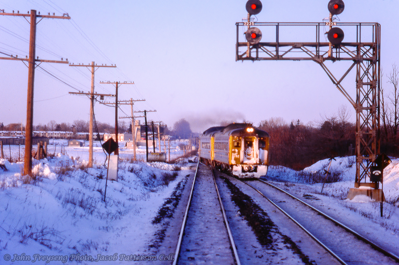 Looking through the front window of RDC equipped train 661, we are stopped at mile 22.3 of the Halton Sub, just east of the then single tracked Credit River bridge, to allow late-running eastbound train 660 from Stratford to clear onto the north track.John Freyseng Photo, Jacob Patterson Collection Slide.