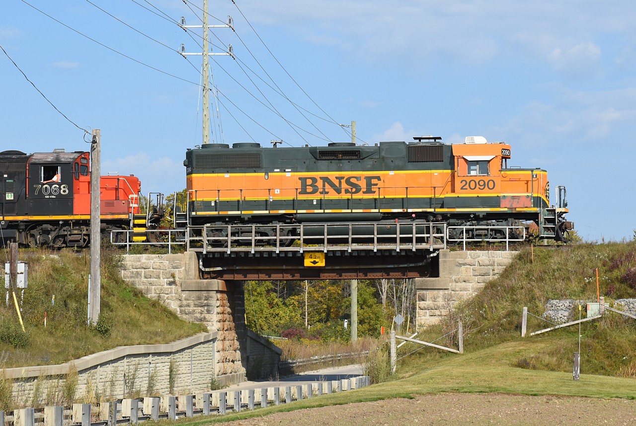 CN L540's first work of the day was to take four empty gondolas down the Huron Park Spur to Triple M Metal on Balzer Rd.  I followed in pursuit, but the sun angle was horrendous for BNSF 2090 leading back north so I decided to return to Kitchener Yard and wait for them to come back.  They threw a wrench in to that plan when they stayed on the south track to go out to the P&H Shantz Station Terminal to reposition cars.  By the time I got out to Shantz Station Rd. they were already done with the repositioning and were ready to head back to Kitchener.  CN 7068 and BNSF 2090 are shown crossing over Shantz Station Rd. heading westbound back to Kitchener Yard.