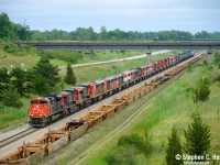 20 Locomotives on a train? Not something that happens too often and I wasn't able to go for the last big move around here. My last big one was 15 units on <a href=http://www.railpictures.ca/?attachment_id=18573 target=_blank> The Wabash transfer</a> in 2015 back when GE Erie made new units. But what's pictured above is a funeral train of units for scrap or re-sale. Sold in a June 2023 auction, SLM recycling has reportedly purchased a total of 46 locomotives (to be confirmed) and this was the first batch to arrive. One engine in this group, BCOL 4618 was on this train, but wasn't part of the auction and was moved in September 2023 and donated to the Alberta Railway Museum. Have any others escaped the clutches of scrap? I heard a rumour another has been sold but not confirmed.<br><br>
I managed to follow this silly train for the day and visited my parents in between waiting for 562 to depart, Arnold can vouch that the weather absolutely sucked but...I don't know when I'll get another chance at this. Maybe when the Dash 9's are retired en masse :)

