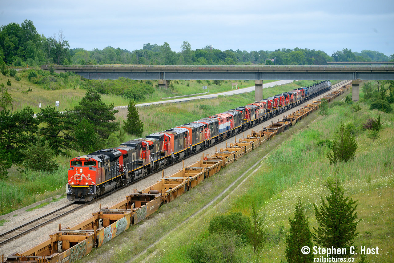 20 Locomotives on a train? Not something that happens too often and I wasn't able to go for the last big move around here. My last big one was 15 units on  The Wabash transfer in 2015 back when GE Erie made new units. But what's pictured above is a funeral train of units for scrap or re-sale. Sold in a June 2023 auction, SLM recycling has reportedly purchased a total of 46 locomotives (to be confirmed) and this was the first batch to arrive. One engine in this group, BCOL 4618 was on this train, but wasn't part of the auction and was moved in September 2023 and donated to the Alberta Railway Museum. Have any others escaped the clutches of scrap? I heard a rumour another has been sold but not confirmed.
I managed to follow this silly train for the day and visited my parents in between waiting for 562 to depart, Arnold can vouch that the weather absolutely sucked but...I don't know when I'll get another chance at this. Maybe when the Dash 9's are retired en masse :)