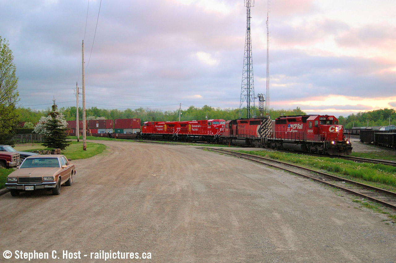 The Junction doesn't look like this anymore, but on a crisp late spring day with the sun setting, CP 167 finally rounds the curve at the Junction with two brand new AC4400's in tow, powered by EMD's finest products ever made (in my opinion, of course).