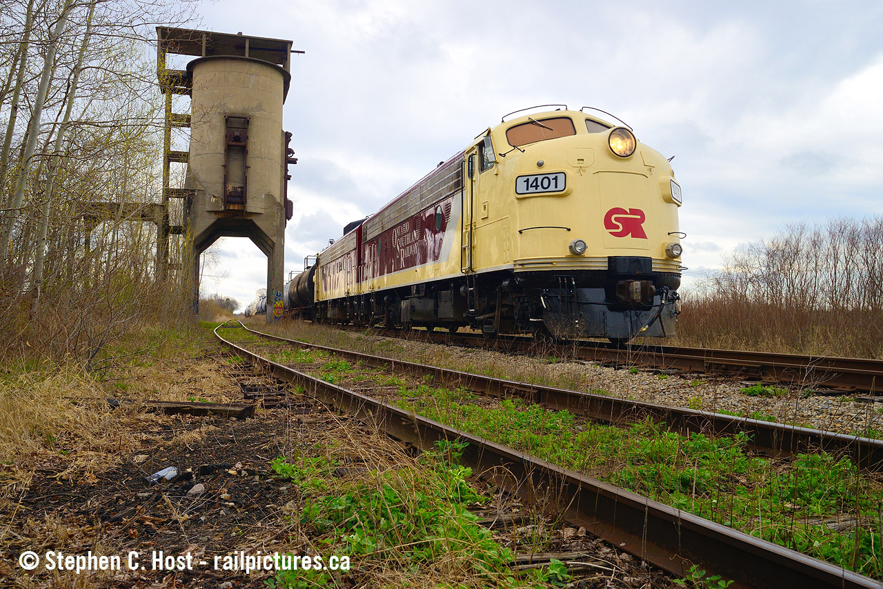 It was a dark and stormy day.... and fitting for a 'last train'. 
On December 6 2019, OSR filed notice with CN that they will be discontinuing operations on the Cayuga Subdivision effective April 30 2020. Rumours were flying around that time that OSR had thrown in the towel and it quickly became fact, leading up to the last trains, what was usually a pair of pups (Knott) which is arguably the least exciting consists OSR can put together (which is saying something in 2023) became more interesting when F units were pulled out of the barn on April 23. This was like catnip for railfans, because anyone with a basic knowledge of the line knew that F units (Thomson)  ran this line for decades(Page) and now you had a chance to do it yourself - On the Wabash and N&W, the F's ran from about 1951 to 1980 (81? 82?) and being mostly in captive service, you saw them often and frequently if you went down this way. OSR Ran them infrequently, you had to get lucky.
In OSR style, the final run was a pair of matching paint F units for the first and last time. A couple dozen folks gathered in Aylmer for the train's last movement westbound and in typical OSR fashion, a stop and show was put on for the fans. OSR President Brad Jolliffe was present, and while consideration was given to pose the F units under the coaling tower proper, there wasn't enough time to get the crew home so this was scuttled. It was actually quite difficult to get a people free shot given how many there were, how disorganized some folks were to not get in the way, and drone(s) flying about in a flurry if activity as if this was it, the last train had left Aylmer. Many waxed poetic that it was the last train ever. If OSR can't do it, who can?
It wasn't the last train, after all,  GIO Rail stepped in  and has been running strongly for almost 2 years now.
GIO Railway's Trillium subsidiary also used to operate the line.. which is kind of fitting. I imagine some of the current staff may have worked on the Cayuga. 
While the OSR era was most certainly interesting, at least we still have rail service on the Cayuga after over 125 years for folks who want to head down for the twice a week runs (Tuesday/Thursday usually). Who knows what the future will bring..