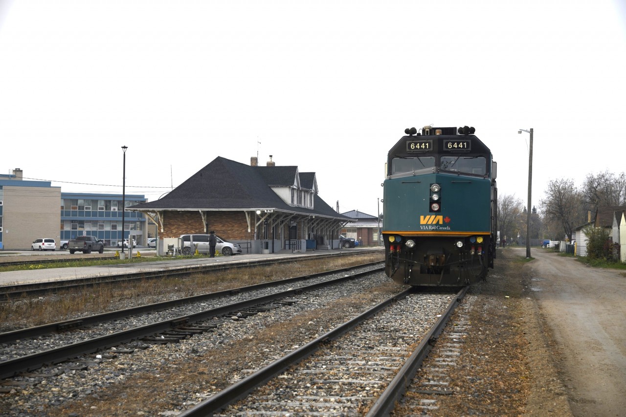 It's 18:00 in the The Pas, MB with overcast skies and a little fire smoke in the air.  
VIA 692's consist with VIA 6441 and VIA 6451 is idling away on Fence Track PZ89 at Mile 0.0 HBR Wekusko Sub., Mile 4.7 The Pas Terminal Sub. 
It will be another 9 hours before there is any activity in this scene which will be just prior to the 03:15 scheduled departure of 692 southbound. 
It was a very pleasant 19C on this September 29, 2023 early evening.