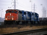 Montreal in December can be a little grey, but in the days when foreign power on CN was unheard of, 2 Conrail SD50's trailing a freight into Tachereau was a real treat. Alas, I did not have a weed-whacking stick handy. 