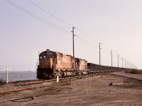 In the 50+ years since this scene, so much has changed.  The British Columbia Harbours Board Railway was only a few years since built (first CP coal train 1970-04-30), with only a single track along the causeway to the Westshore Terminals dumper loop at Roberts Bank, and MLW M-630 units like 4554 and 4570 (and unseen remotes) still reigned on the unit coal trains (an astonishing 88 cars long) from southeastern BC.  Now there is a significant yard on the left side of the photo, and a large intermodal terminal on the right behind the photographer, and the MLWs are long history.<p>Forty years (almost to the day!) later, this was where the last workday of my CP career occurred, as a roll-by inspection of a departing much longer coal empties with GE power.