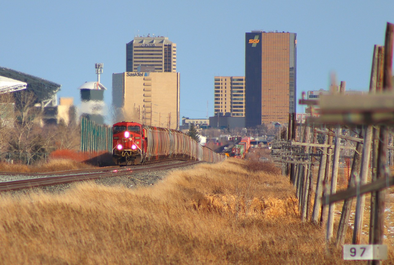 Here we are just outside of Regina, SK. CP 603 thunders past CP 112 which had just pasted a moment ago, I was ready to call it a day when I heard another train, prompting me to run back like a fool, and setup my video tripod as quickly as I could because I had just collapsed it. As soon as I got my video going I pointed my camera and took some photos, this one being my favorite as you can still see 112's rear-DPU. Another thing I found neat about this photo is you can see the grade.