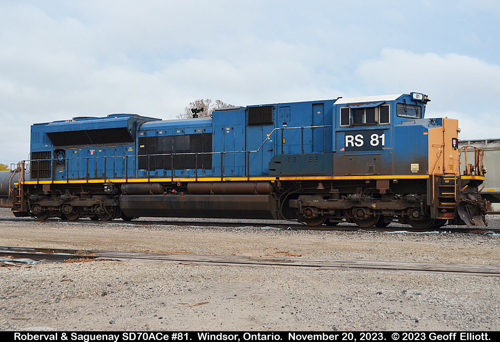 Roberval and Saguenay Railway SD70ACe #81 sits in the CPKC Yard in Windsor, Ontario on November 20, 2023.  RS #81 is joined by #80 which is out of the picture here.  #81 started life as CSX #4831 and was then sold to Progress Rail to become PRLX #4831, and then RS #81.  The unit was used on the Roberval and Saguenay for a short period before being moved to North Bay and stored at the ONR Shops.  #80 and #81 made it Windsor via CN and were interchanged to the Essex Terminal to then move them to the CP Interchange.  Not sure what the final destination for the units is yet, but I would assume that they are headed back to Progress Rail.