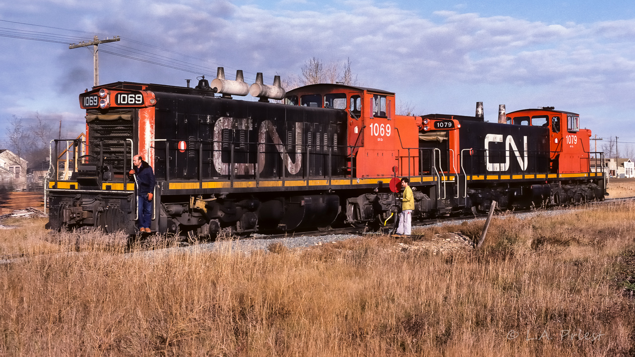 I saw this go by as a cabhop at 9:30 from my house in Redwater. I waited awhile before going to take photos, I knew they would be busy building a train at Egremont. My arrival at 10:30 found them about halfway done to building a train. The cars they came for were stored on the abandoned portion of the Lac La Biche Sub and the Egremont siding was not a large one. So, it was a few cars at a time, runaround them, shove them down the main, cutoff, go get a few more. This photo shows them busy doing what I just mentioned. By 12:30, a train of 65 empty covered hoppers was rolling through Redwater and on the way to Edmonton.