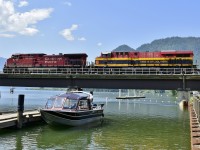 Water level is reaching a peak as this westbound grain is crossing the narrows on Shuswap Lake. KCS units are becoming a more common site on the Shuswap sub since the CP/KCS merger earlier this year.