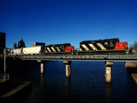 Consecutively numbered GP9s lead CN 500 over the Lachine Canal.