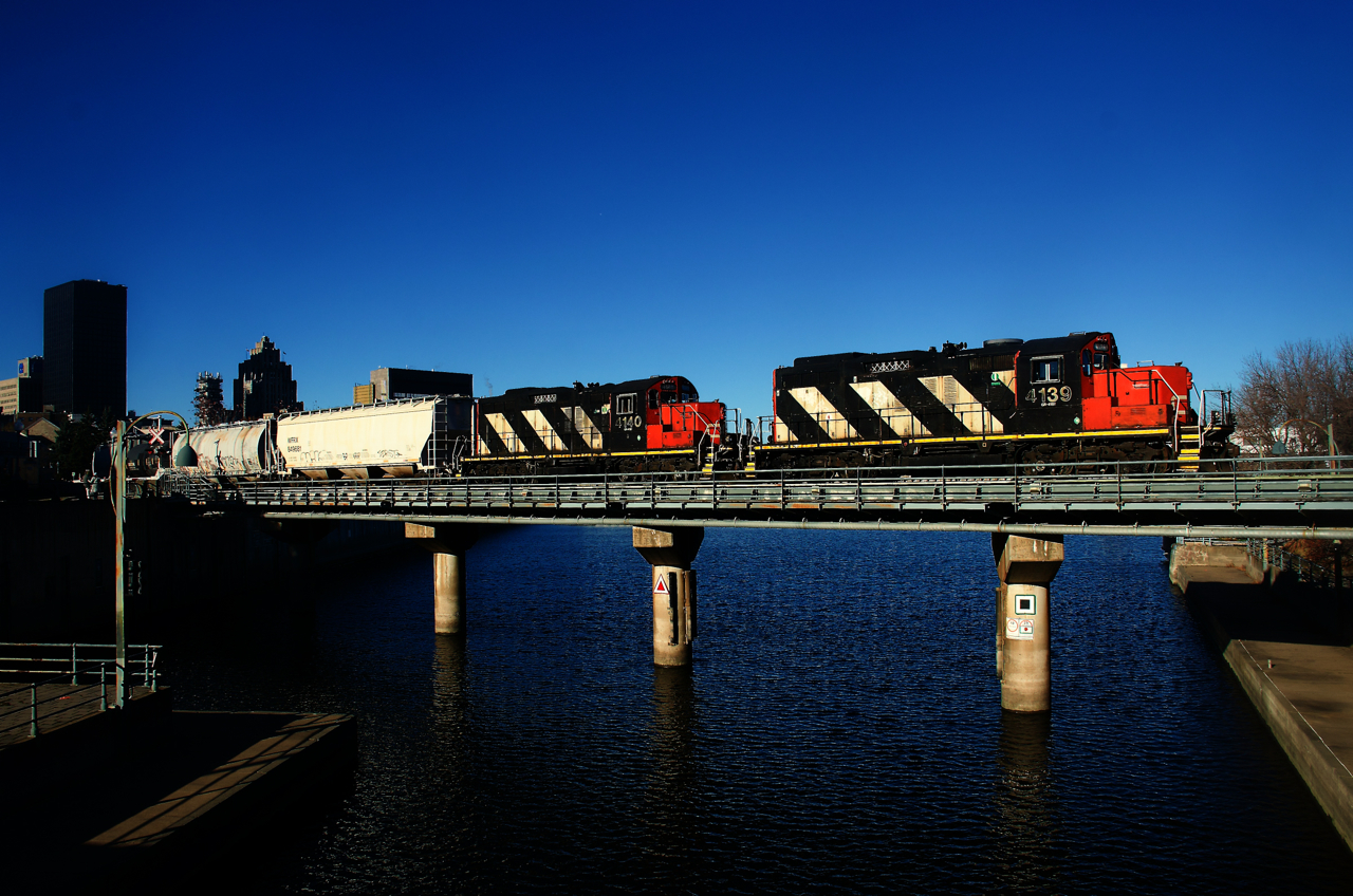 Consecutively numbered GP9s lead CN 500 over the Lachine Canal.