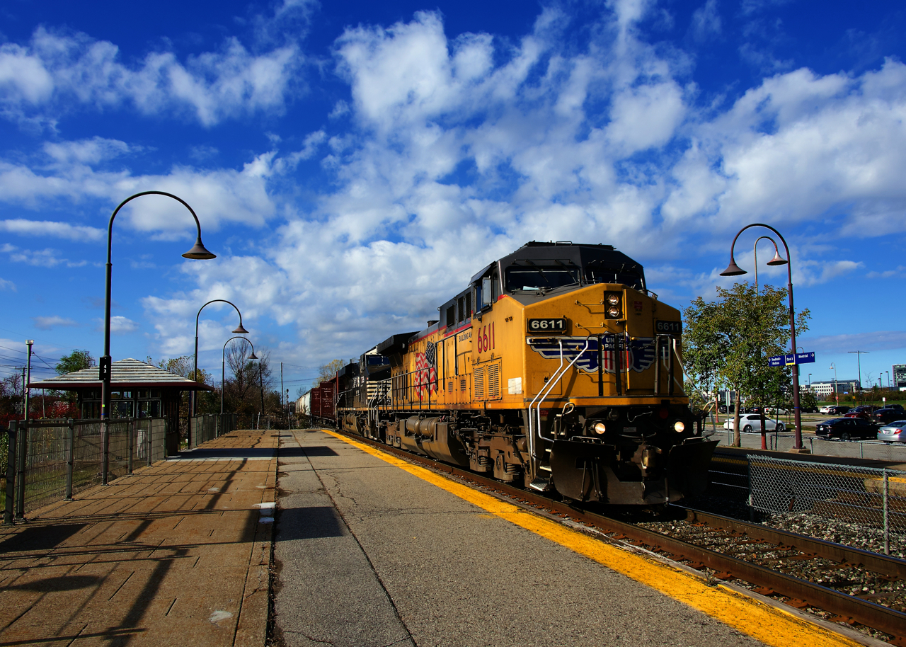 An extra rolls through Dorval Station with UP & NS power (UP 6611 & NS 7635).