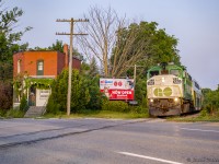 The early morning GO train out of London slows as it enters the town of Stratford, crossing Highway 7.  In a few minutes it will make its station stop, where about thirty passengers will board.
