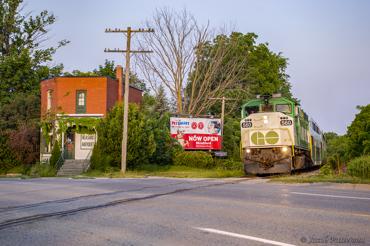 The early morning GO train out of London slows as it enters the town of Stratford, crossing Highway 7.  In a few minutes it will make its station stop, where about thirty passengers will board.
