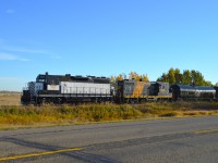 The Alberta Prairie railroad is obviously more than just tourist excursions.  In this photograph we see a local returning from Botha to Stettler with APXX 6347 and 7438 up front.  The image was shot from alongside Hwy 12 which parallels the line for a few miles. Lighting was tough as it was very early morning.
I am quite sure the 7438 is one of those old Conrail engines I used to see when wandering around Niagara many years ago. The CTG states it began life on the NYC and the lead unit 6347 was once the property of the Southern Pacific.  Interesting !!