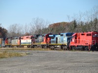 Impressive collection of stored power building up  at the GIO facility off Philips Rd. From the right, JLCX 3502, CN (IC) 2462, CN 2019, CN (BCOL) 4623, and these eyes could not make out the last two, 24xx and a 20xx. I guess these are all stored in a safe place (NO trespassing) pending a new home.  Rescued from the scrapper.